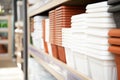 Shelf with plastic flower pots. Royalty Free Stock Photo