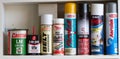 Shelf of spraypaint and lubricants for the average home handyman