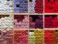 Shelf in a store full of colorful balls of yarn Royalty Free Stock Photo