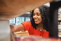 Shelf, store and shopping black woman in grocery shop, choice or select food products. Retail, supermarket and female Royalty Free Stock Photo