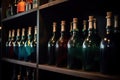 Shelf with wine old bottles in the winery Royalty Free Stock Photo