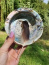 Shell abalone with Feather. Me Holding it in the Wind near the Water and Fountain of Happiness