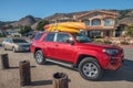 Shell Beach street view, cars with kayaks mounted on top. Shell Beach is a best spot along the coast for diving and kayaking