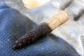 Shell of an old World War II military bullet found rusty underground and excavated Royalty Free Stock Photo