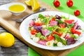 Shell pasta delicious salad with mixed lettuce leaves, salami on Royalty Free Stock Photo