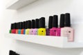 Shellac nail color on the shelf. gel for nails polishes bottles, are in the window of the manicurist. Nail polishes are on the Royalty Free Stock Photo