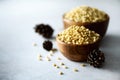 Shelled organic pine nuts in wooden bowl. Nuts background. Top view, copy space