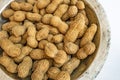 Shelled peanuts in metal bowl Royalty Free Stock Photo