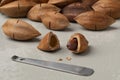 Shelled pili nut close up and unshelled at the background Royalty Free Stock Photo