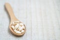 Shelled pine nuts in spoon on the wooden background with copy space Royalty Free Stock Photo