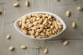 Shelled pine nuts in a white bowl