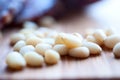 Shelled pine nuts on a wooden board Royalty Free Stock Photo