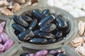 Shelled ripe seeds of kidney bean on heap. Sorted pile of dry raw seeds of haricot Phaseolus vulgaris in glass plate.