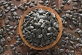 Shelled sunflower seeds in wooden bowl, top view Royalty Free Stock Photo