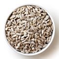 Shelled sunflower seeds in small white bowl isolated from above. Royalty Free Stock Photo