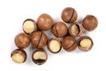 Shelled and unshelled macadamia nuts isolated on white background. Top view. Flat lay pattern