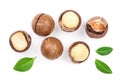 Shelled and unshelled macadamia nuts with leaves isolated on white background. Top view. Flat lay pattern Royalty Free Stock Photo