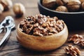 Shelled walnuts, nutcracker and bowl of nuts Royalty Free Stock Photo