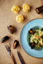 Shellfish Mussels in copper bowl with lemon and herbs. Shellfish seafood.