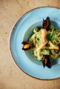 Shellfish Mussels in copper bowl with lemon and herbs. Shellfish seafood.