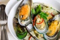 Shellfish mussels in cream sauce with white wine and chili pepper.