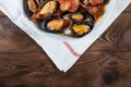 Shellfish seafood. Hot fresh italian appetizing steamed mussels in tomato sauce with olives and red pepper on vintage wooden table