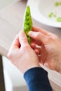 Shelling fresh green peas