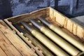 Shells from the gun are in the box. New ammunition arsenal in a box Royalty Free Stock Photo