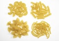 Shells, Macaroni, Spaghetti and Twisted Pasta Against White Background