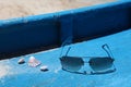 Shells and sun glasses on a boat deck, Boracay Island, Philippines Royalty Free Stock Photo