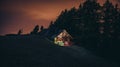 Shelter in the mountain with the help of bright colored lights lamps LED on the background of wild mountain scenery