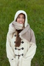 Sheltered girl with hood and scarf