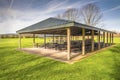 Sheltered picnic tables in Blue Lake park Oregon. Royalty Free Stock Photo