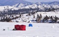 Shelters for ice fisherman on frozen lake