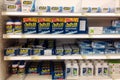 Shelves of Advil and ibuprofen pain relievers in a store
