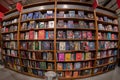 Shelves with books novels of comedy and fantasy on sale in bookshop Royalty Free Stock Photo