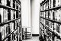 Shelves of Books, Vacant Seat Royalty Free Stock Photo