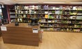 Shelves with bottles. Shelving, shop and cash