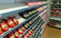 Shelves of colorful Swedish Dala clogs in a souvenir boutique