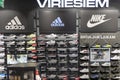 Shelves with different types of men sneakers with big discounts on sale