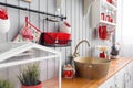 Shelves with dishes. Interior light grey kitchen and red christmas decor. Preparing lunch at home on the kitchen concept Royalty Free Stock Photo