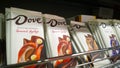 Shelves with famous brand milk chocolate Dove. Delicious Candy with nuts. Aisle in supermarket. Promotion. Retail industry.