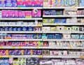 Shelves with feminine hygiene products from different manufacturers in Rimi hypermarket, Riga