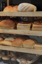 Shelves filled with freshly baked loaves of bread