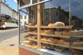 Shelves filled with freshly baked loaves of bread