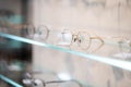 shelves with glasses in Ophthalmological cabinet or eye glasses store, equipment in medical clinic shop. Royalty Free Stock Photo