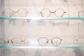 shelves with glasses in Ophthalmological cabinet or eye glasses store, equipment in medical clinic shop. Royalty Free Stock Photo