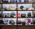 Shelves with Guess fashion bags on sale with big discounts