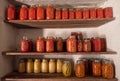 Shelves with Home Canned Salsa, Tomatoes, Sauerkraut, Carrots, and Okra