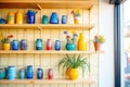 shelves lined with colorful vases and plant pots